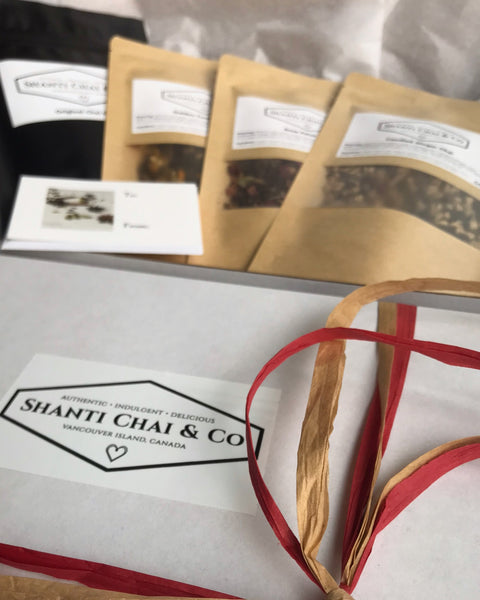 Shanti Chai & Co's Specialty Chai Gift Set comes in a white box wrapped in festive ribbon.